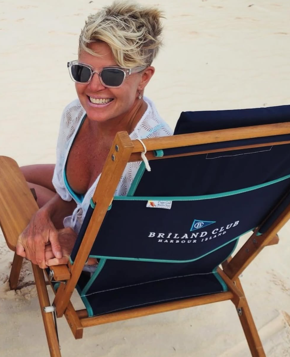 happy lady at Briland resort in a customized cape cod beach chair